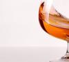 Drinking alcohol dilates or constricts blood vessels in the brain